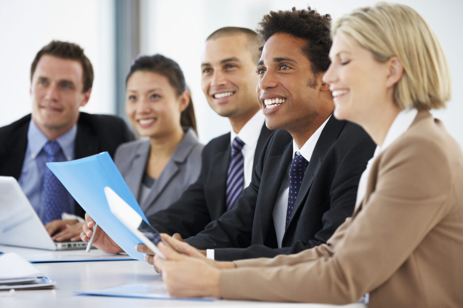 A group of people sitting at a table.